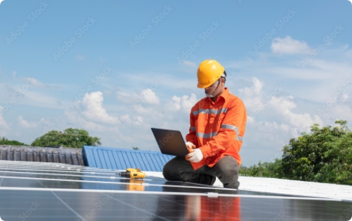 A contractor completing commercial solar panel installation