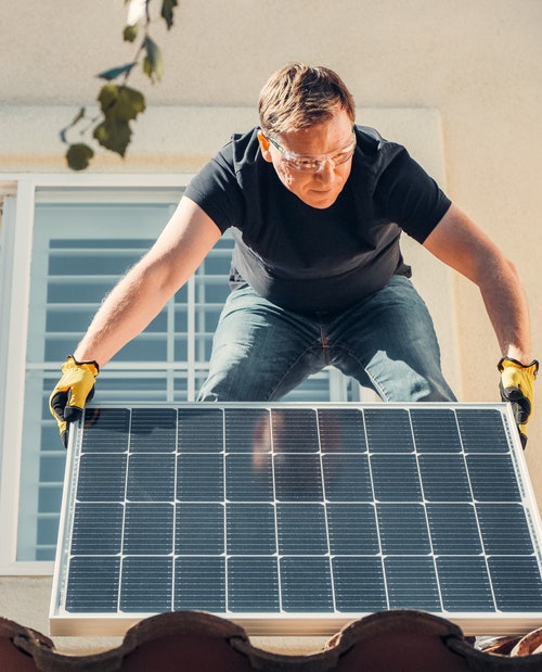 A solar energy contractor readying panels.