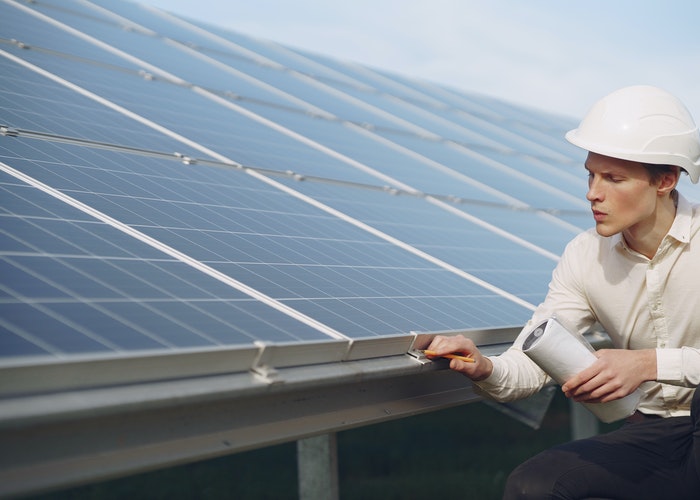 A solar contractor inspecting a solar installation in MA.