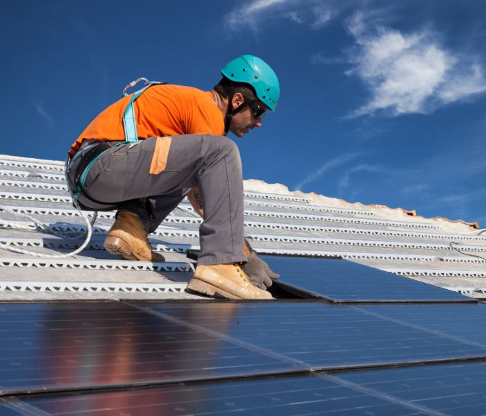 A contractor preparing solar panel installation in MA.